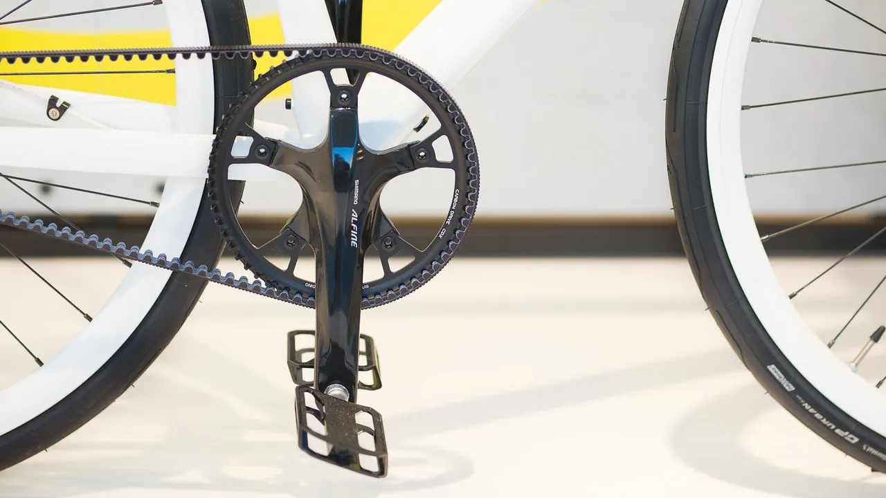 Rider pedaling a single-speed bicycle on the road