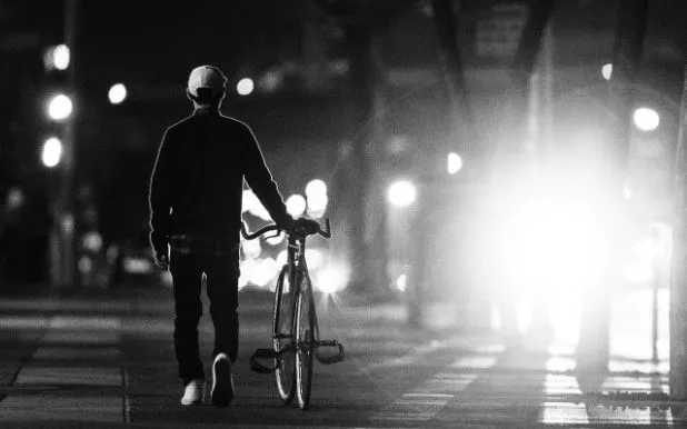 Child learning to balance on a bicycle without training wheels