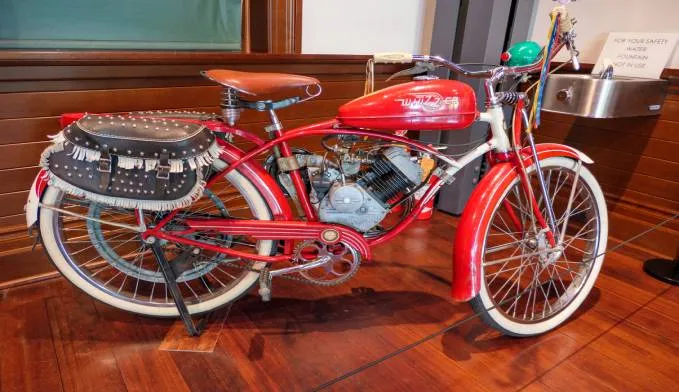 Motorized bicycle with a small gasoline engine mounted in the frame
