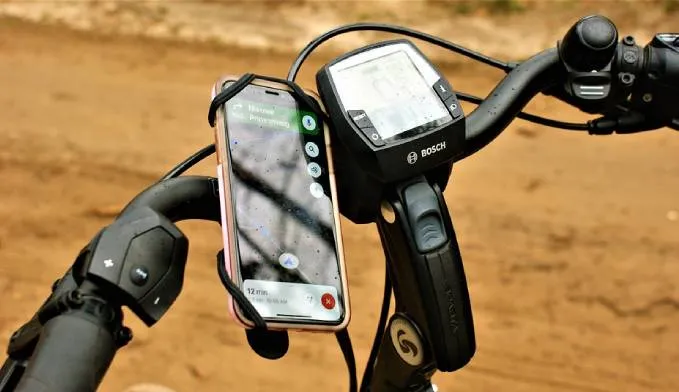 Smartphone mounted on bicycle handlebars for navigation