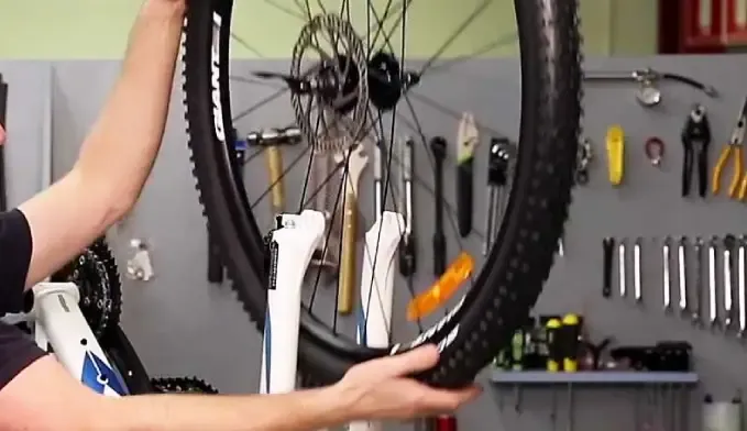 Installing a front wheel with a disc brake rotor