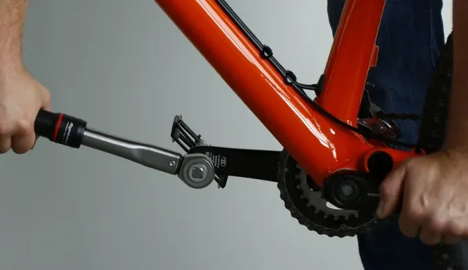 Hex wrench positioned at the back of a Shimano bicycle pedal axle