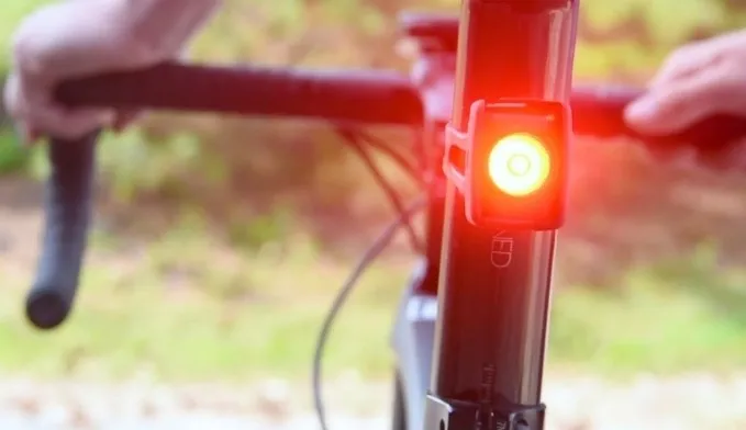 Daytime bicycle rear light mounted below a saddle
