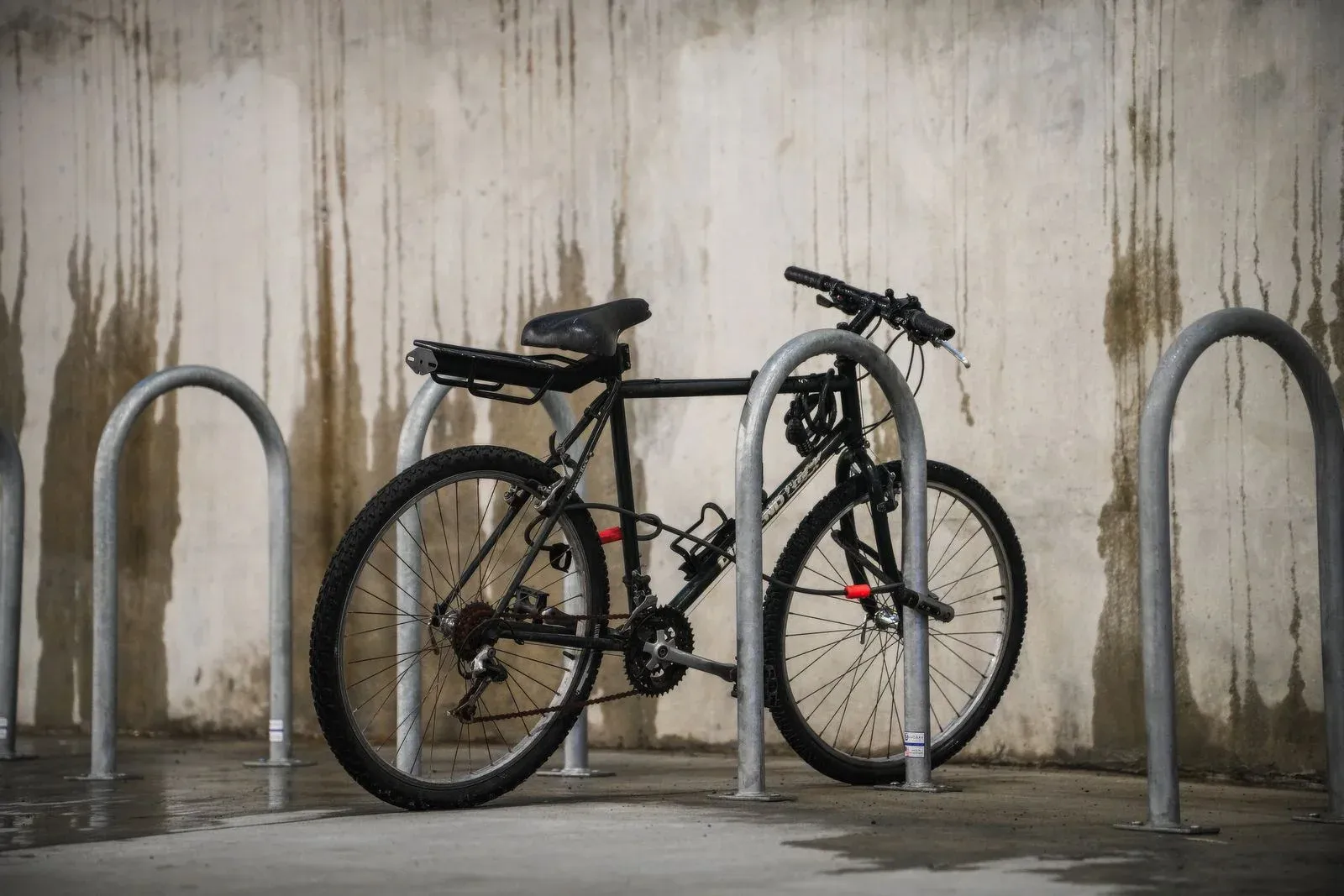 Bicycle secured at a metal bike rack