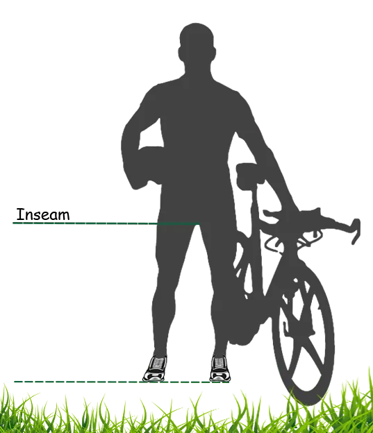 Rider measuring inseam beside a bicycle as part of a fit check