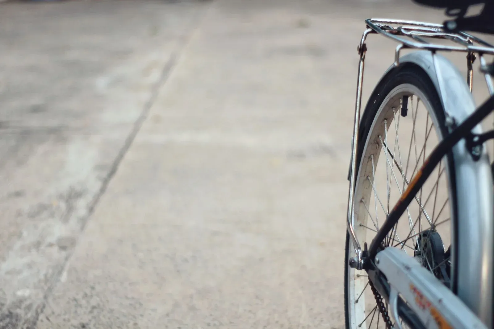Bicycle wheel and tire against a concrete background